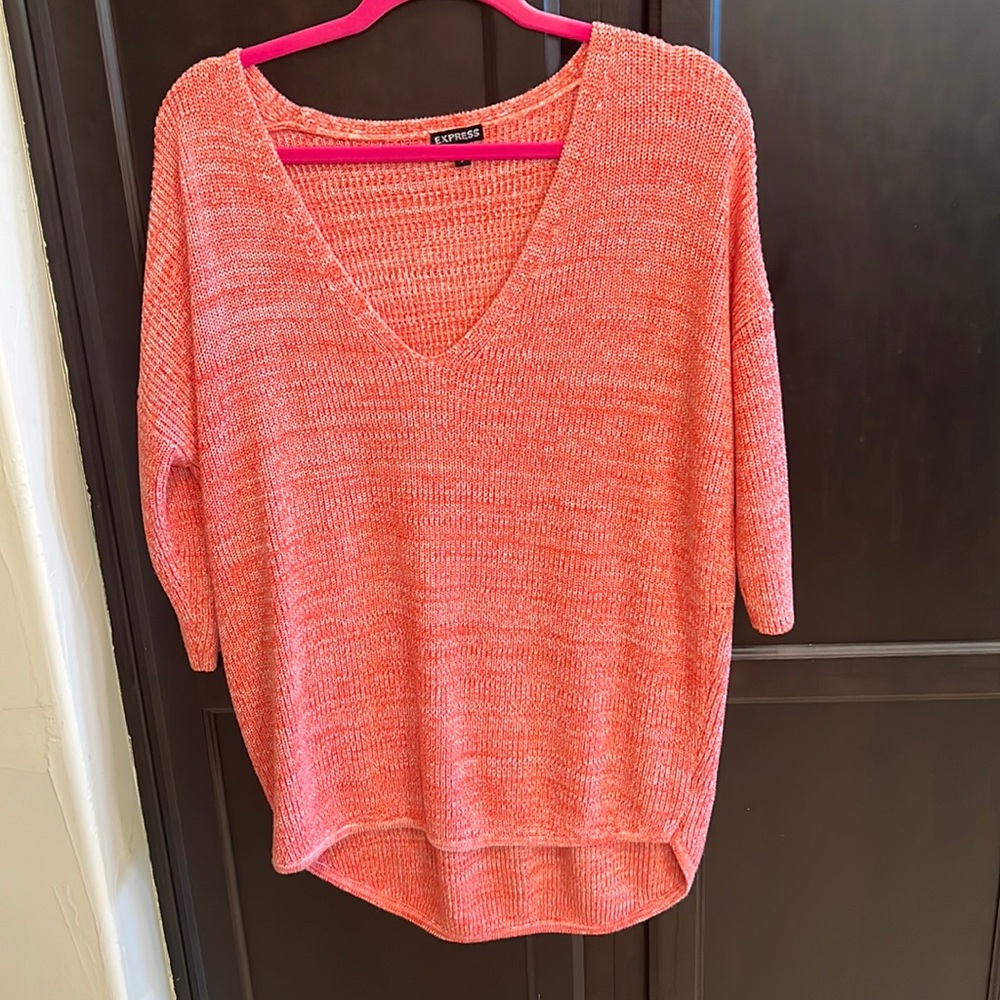 Oversized 3/4 length sweater with longer back.  Perfect with leggings & boots.
